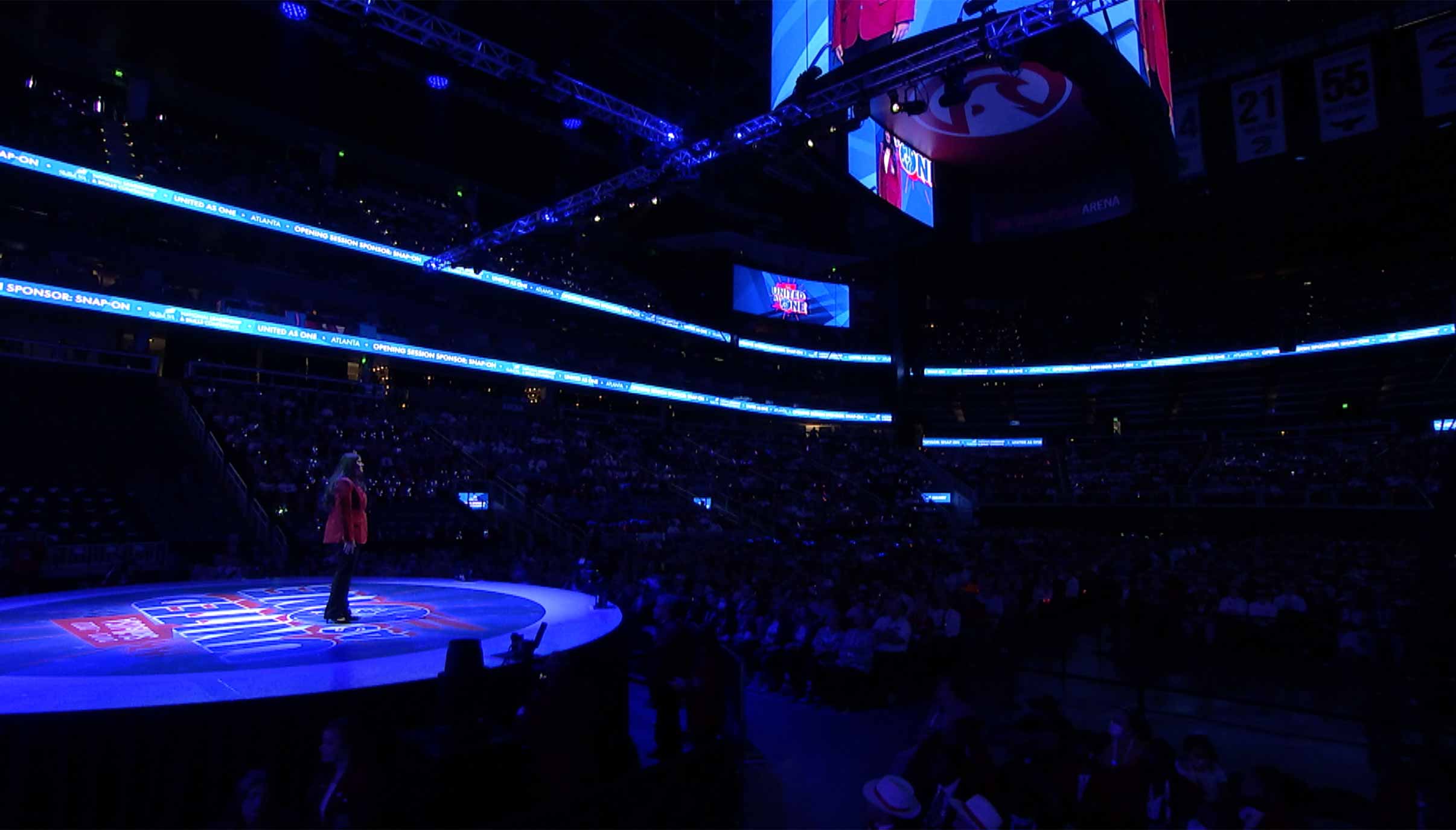 Digital render of the stage with officer awards being announced.